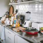 a modern kitchen with a cluttered kitchen counter